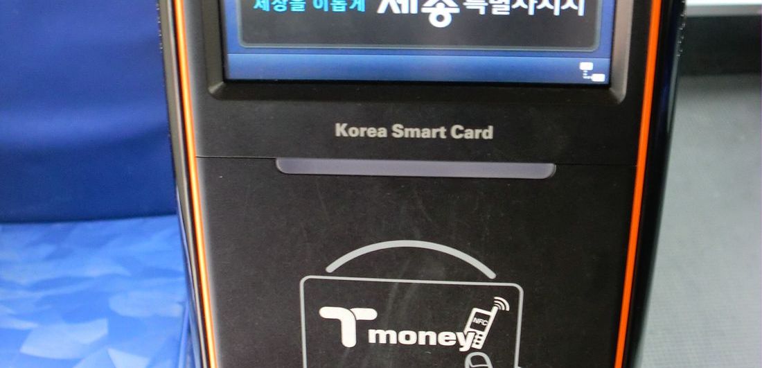 The reader on a Korean city bus — hold your card flat against the marked panel. In the subway a gate stops you, so the exit tap is impossible to forget; on a bus the rear door just stands open, and that’s where travelers get burned.